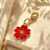 Venta Caliente Transfronteriza Aleación Esmalte Flor de Cerezo Colgante Broche Universal DIY Ropa Llavero Bolso Collar Pendientes Accesorios