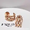 Aretes de oro de 18 quilates de Fred incrustados con diamantes con diseño de nudo doble y elegante collar con borla en forma de pera, un toque de lujo y moda