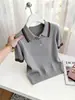 Camisa polo de venta caliente con bloques de color y rayas tejidas para mujer, nueva moda primavera-verano 2026, top de manga corta ajustado