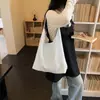 Bolsa feminina de alta qualidade com textura, grande capacidade, modelo novo primavera-verão 2026, bolsa de ombro tote estilo relaxado Maillard