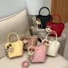Bolso de Mano de Cuero Suave de Moda de Nicho para Mujer 2026 Nuevo Modelo Versátil de Gama Alta Bolso Cruzado Cubo para Viajes Diarios