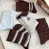 Meias listradas color block estilo coreano para mulheres com cores vintage, etiqueta de tecido listrado Keloqi, bordado de gatinho, meias largas para meninas