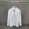 Camisa com Fivela de Metal Estilo Francês, Gola Alta, Mangas Longas, Corte Amplo, Elegante e Sofisticada, Outono/Inverno 2026, Transfronteiriça