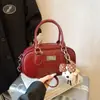 Bolsa Pequeña de Mano para Jugador de Bolos Transfronterizo para Mujer 2026 Nueva Versátil Textura Bolso de Hombro Único Bolso Cruzado Boston