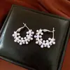 Pendientes de borla con flor de trébol de circonita vintage con un toque de alta gama, pendientes versátiles y de moda al por mayor