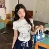 Camiseta de Manga Corta de Algodón Puro con Hombros Rectos, Diseño de Nicho de Moda para Mujer, Verano Estilo Americano Chica Picante Corta Ajustada Adelgazante Top