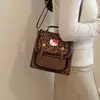 Mochila nicho fresco caricatura 2026 mochila para ir al trabajo nuevo estilo femenina lindo estilo pequeño versión coreana escolar estampado de leopardo moda