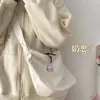Nova bolsa de ombro e transversal feminina versátil e simples para uso diário, estilo coreano, cor de doce, padrão waffle, artística, transfronteiriça, para estudantes