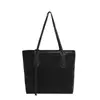 Bolso tote de gran capacidad para mujer 2025, simple y elegante para ir al trabajo, bolso de mano de un solo hombro a la moda, modelo nuevo con textura de PU, bolso grande