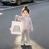 Elegante top de manga larga para bebé niña para primavera y otoño con corbata de lazo y diseño de lunares en contraste