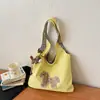 Bolso casual de tela de gran capacidad para mujer, nuevo diseño de moda de verano 2026, bolso de hombro simple, bolsa tote para uso diario