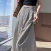Pantalones de pierna ancha a rayas de tela de seda helada para mujer 2025 Nuevo verano finos de cintura alta adelgazantes de pierna recta casuales