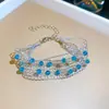 [Cadena de Diamantes Arcoíris] Pulsera de extracción de zircón trenzado en cruz, una pulsera lujosa y de alta gama, una pieza de joyería delicada y de moda