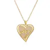 Amazon Europeo y Americano Cobre Zircón Forma de Corazón Amor Joyería Chapada en Cobre Oro Hueco Colgante de Corazón Collar para Mujeres