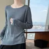 Suéter de punto de lana de hilado fino con diseño de dobladillo asimétrico, de manga larga, corte ajustado, cuello redondo, top base para otoño