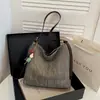 Bolso cubo tejido hueco transfronterizo 2026 nuevo de moda de alta gama para el hombro y cruzado gran capacidad versátil para el día a día