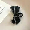 Nuevo pasador de pelo para mujer 2026, pinza de garra elegante para la parte trasera de la cabeza, pinza de tiburón de alta gama, pequeño accesorio para el pelo de lazo blanco y negro estilo Chanel