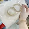Pulseira cat-eye mais vendida para mulheres em azul gelo, série de cores completas em gradiente Maron Dragon, textura de luxo leve, atacado de fábrica, vendas diretas da fábrica