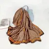 Venta al por mayor de fábrica Nuevo satén de brocado de Li 90*180 estampado Bufanda larga de playa Versión coreana de chal de seda