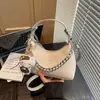 Bolsa de bolinho transfronteiriça super popular para mulheres, nova bolsa de mão versátil para o verão de 2026, bolsa de ombro e transversal simples e estilosa
