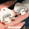 ¡Brillando intensamente! Pendientes de mariposa con circonita de aguja plateada, pendientes de lujo ligero para el día a día, estilo simple y versátil, pendientes de moda al por mayor