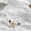 Estilo vacacional bohemio flor tejida con concha cuenta de madera cuerda collar ajustable para mujer joyería al por mayor