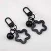 Llavero con Colgante de Campana de Estrella de Cinco Puntas de Colores Caramelo de Aleación Cubierta para Auriculares Decoración de Pareja