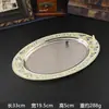 Bandeja metálica ovalada de estilo europeo con motivos florales de colores esmaltados, adecuada para servir fruta, como bandeja de té en hoteles, o para guardar frutos secos.; una pieza decorativa para la decoración del hogar
