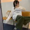 Camiseta de Algodón de Manga Larga con Estampado de Letras Estilo High Street Americano para Mujer Diseño Primavera y Otoño 2025 Ropa Casual y Versátil
