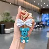 Llavero de Oso con Lentejuelas Completas, Moño de Tela Rayada, Etiqueta con Letra, Colgante de Figura de Arcilla, Encanto para Bolsa, Venta al por Mayor