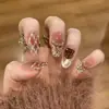 El Artículo de Moda Más Vendido de Celebridad de Internet de Xiaohongshu: Puntas de Uñas Ojo de Gato de Vidrio Dorado Champagne Ligeramente Borrachas con Tonos Rosados que Realzan el Cutis y Añaden un Toque de Lujo
