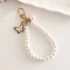 Creativo Elegante Nuevo Colgante de Mariposa de Perla Artificial DIY Llavero de Equipaje Colgante Cámara CCD Correa para Teléfono Móvil Oreja