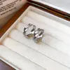 Pendientes redondos de metal con patrón trenzado e entrelazado estilo Ins coreano, diseño simple de nicho, pendientes de botón, pendientes para el día a día