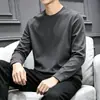 Camiseta casual versátil de manga larga para hombre para otoño, cuello redondo, color liso moderno, cómoda, transpirable y de corte holgado.