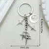 Llavero Popular de Cuatro Puntas Cruz Estrella Luna Transfronterizo Moda Colgante Decoración Simple para Bolso Amazon