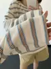 Camisa Henry estilo Miu con botones de cuerno, camiseta larga a rayas retro y casual holgada para mujer, nuevo estilo casual