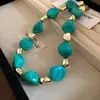Collar de doble capa con cuentas acrílicas transfronterizo europeo y americano, cadena para la clavícula de lujo ligero de alta gama, joyería de estilo étnico vintage al por mayor