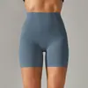 Pantalones de yoga de estilo nuevo sin línea de vergüenza color piel para mujer, cintura alta, realce de glúteos, compresión abdominal, shorts deportivos de tres puntos