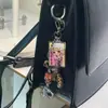 Estilo Millennial Colgante Acrílico Bolso Llavero para Teléfono Móvil Cadena Colgante Accesorios Libreta DIY Personaje Original Bolsa de Dolor