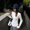 Suéter de punto con borde enrollado y cuello redondo para mujer, nuevo top básico de otoño e invierno, adelgazante, estilo europeo y americano, elegante para ir al trabajo