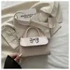 Bolso pequeño de alta gama para mujer, nuevo 2026, lazo francés, bolso cuadrado pequeño para el trabajo, bolso versátil de un solo hombro cruzado