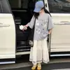 Conjunto de Vestido de Bolo de Verão para Meninas 2026 Novo Estilo para Meninas Mais Velhas, Camiseta Infantil Estilo Coreano Super Popular com Estampa de Desenho Animado de Manga Curta