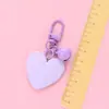 Nuevo llavero Bell love colgante lindo color resina corazón de durazno accesorios pequeño fresco adornos de corazón de durazno