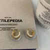 Aretes colgantes vintage de moda de primavera y verano azul agua con aceite goteado 2025 nueva explosión alto sentido arete nicho temperamento aretes