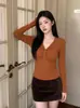 La popular y explosiva ropa de mujer de este año Otoño 2026 Nueva Camiseta Básica de Color Sólido Única Retorcida Top de Manga Larga