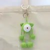 Pingente de Boneca de Crochê Feito à Mão com Olhos Grandes, Enfeite de Chaveiro Tricotado com Lã, Decoração de Bolsa de Boneca Cartoon Tecida