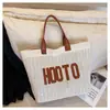 Venta al por mayor para comercio exterior 2026 nueva bolsa tejida, bolso de hombro de moda para mujer de gran capacidad con elegante estampado de letras, bolso tote cruzado