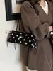 Bolso de axila de lunares estilo coreano, nicho súper popular para mujer, nuevo modelo otoño 2026, bolso de hombro exquisito y elegante, versátil para el trabajo