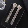 Joyería coreana suministro transfronterizo aretes de borla de amor de diamantes completos aretes de cadena de garra con pedrería fabricantes al por mayor E689