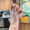 Cadena de Teléfono de Cristal con Lazo Translúcido Estilo Nuevo de Ensueño, Colgante Exquisito de Nicho para Bolso de Niña, Lanyard de Teléfono con Perlas